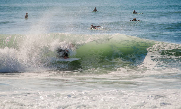 istock Surfer in a barrel falling under the force of the waves 1725788742