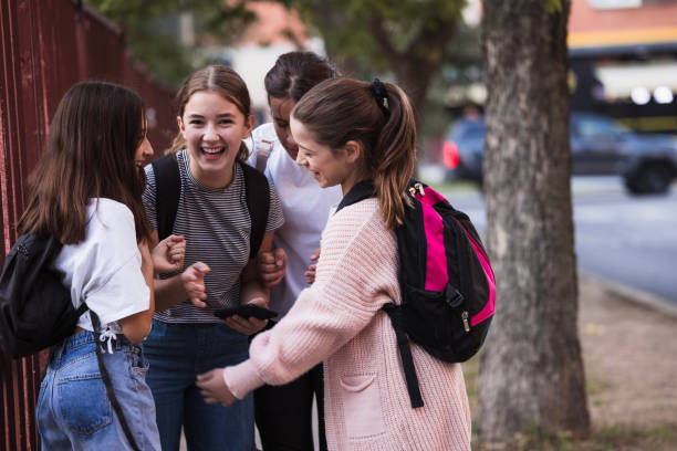 Girls having fun on their way to school
