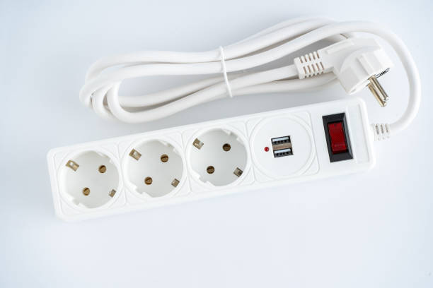 istock Electrical outlet extension cord. White cable with USB connector for charging phones. Electrical appliance. White background 1725836068