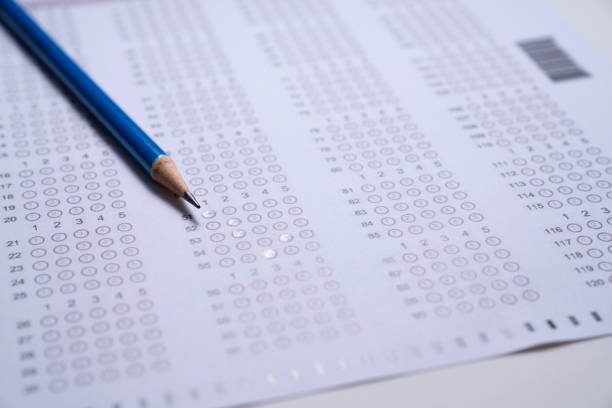 istock close up blue pencil on answer sheets, education concept 1725836648