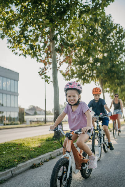 istock Family riding bicycles together 1725867959