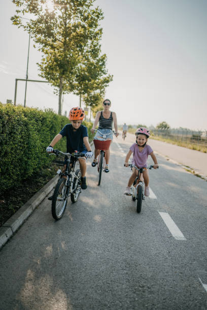 istock Family riding bicycles together 1725868499