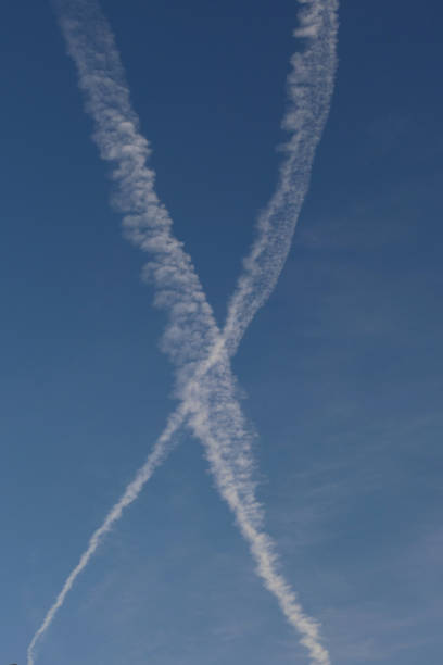 istock Airplane trail in the blue sky, white clouds in the blue sky 1725879055