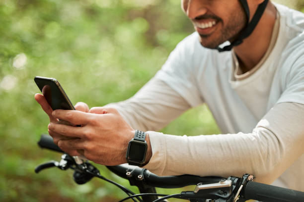 istock Man, forest and phone on bicycle, texting or smile for web chat notification for adventure on location. Guy, cycling and smartphone for search location with bike, relax or social network app in woods 1725880731