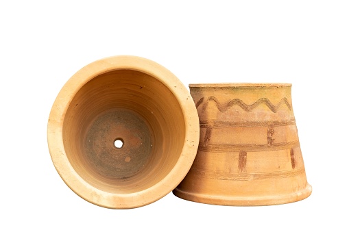 a clean golden indian brass vessel used as a water pot for traditional rituals during religious hindu festivals isolated in a white background