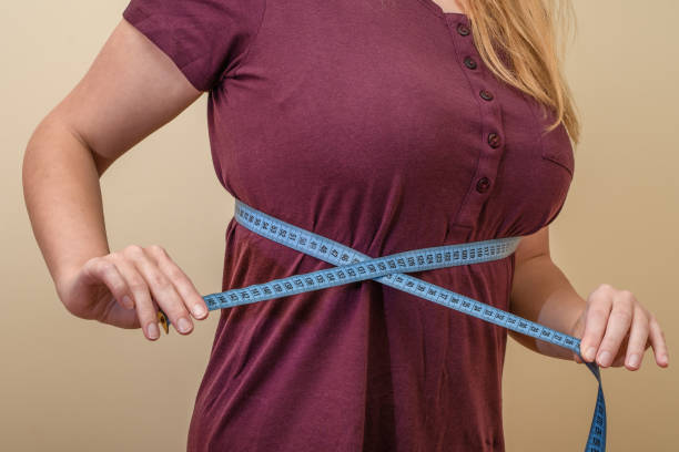 istock Measuring a woman's body circumference by a seamstress 1725905496
