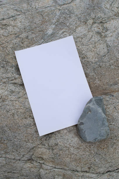 istock Layout of poster on stone. White blank with space for text or design 1725926326