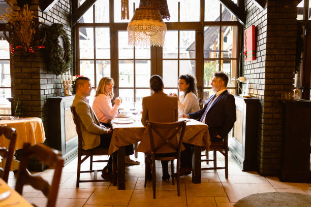 istock Business people having dinner in luxury restaurant 1725954572