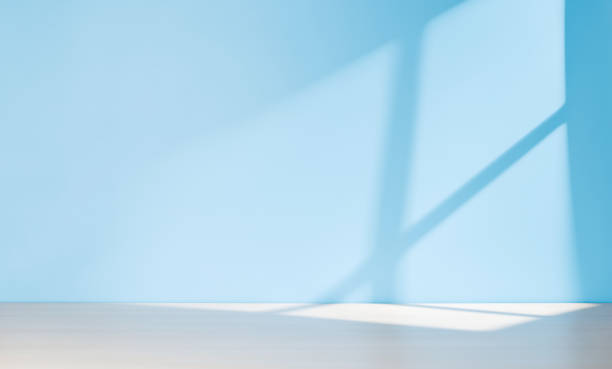 istock Wooden table and sunlit wall, product template 1725970143