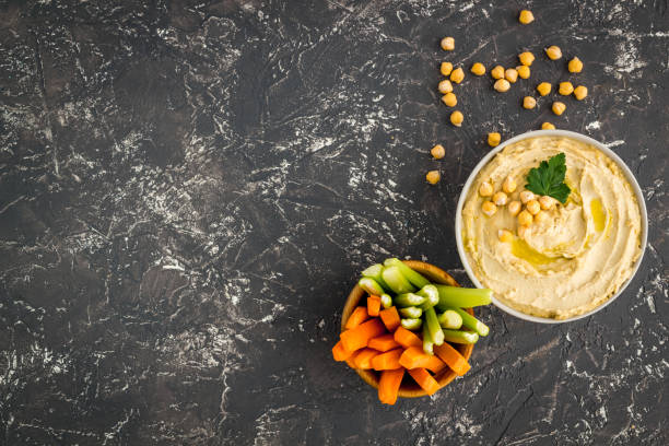 istock Vegetarian dish - hummus with vegetables sticks 1725974797