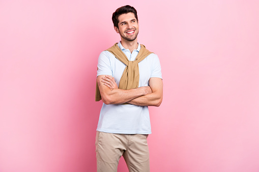 Photo of cheerful glad man wear stylish outfit watching empty space special black friday proposition isolated on pink color background.