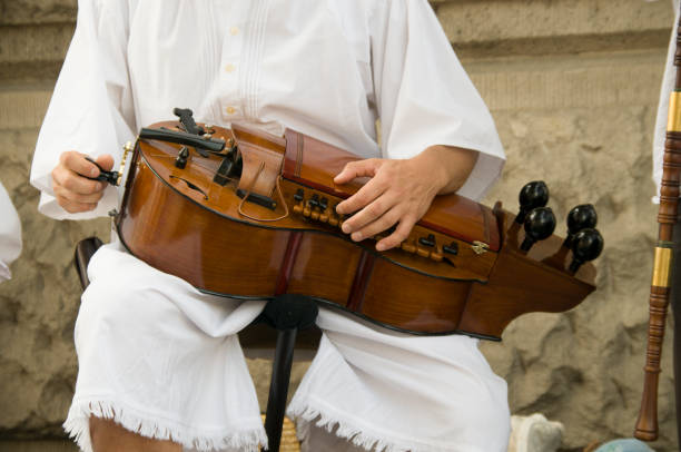 istock Man plays a Hungarian Hurdy Gurdy 1725987818