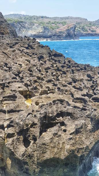 istock a large rock formation next to the ocean 1726017506