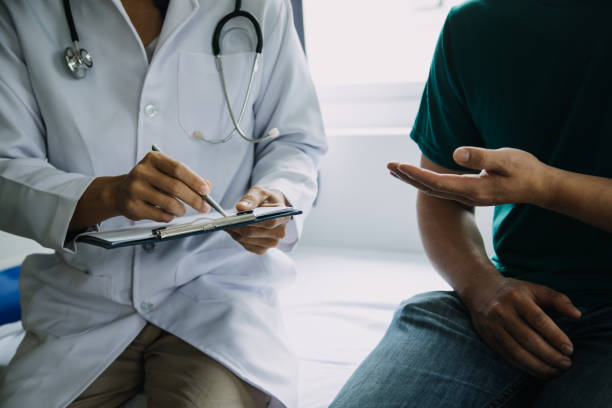 istock close up of patient and doctor taking notes 1726021196