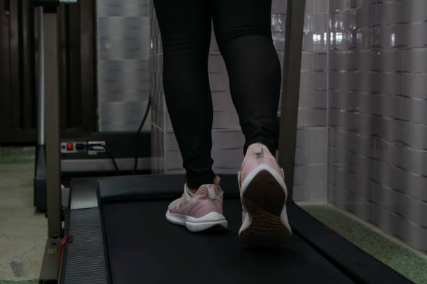 istock young woman running exercise on gym machine 1726031437