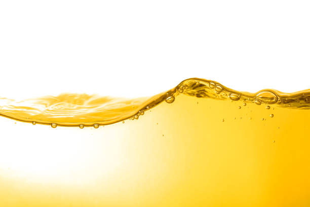 istock Oil wave background, yellow liquid, and bubbles on white background. 1726052395