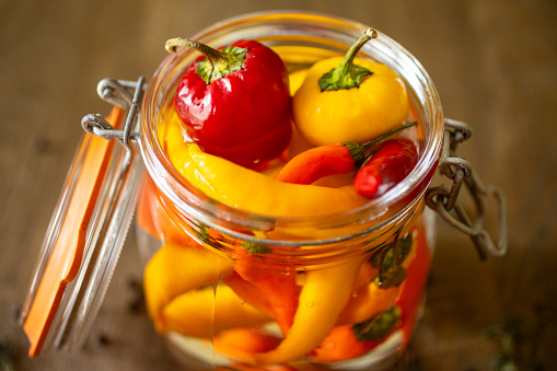 Closeup  of  pickle with red and yellow bell peppers. Sustainability and healthy eating concept