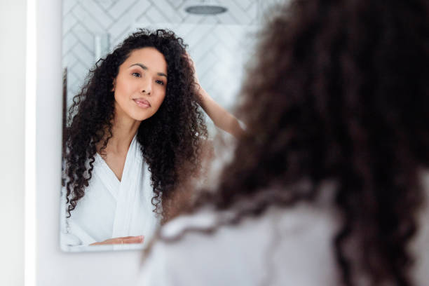 istock Bathroom Beauty: Woman in the Mirror 1726063654