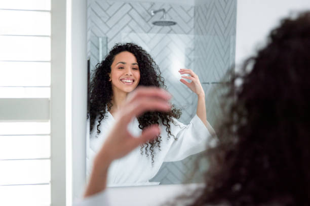 istock Bathroom Beauty: Woman in the Mirror 1726064199