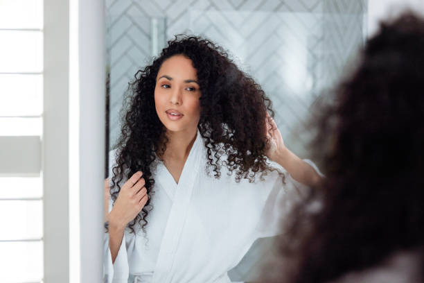 istock Bathroom Beauty: Woman in the Mirror 1726064254