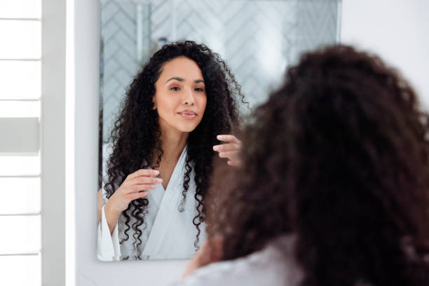 istock Bathroom Beauty: Woman in the Mirror 1726064256
