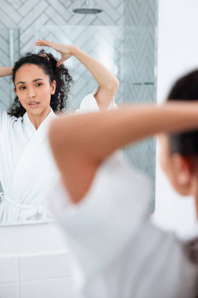 istock Bathroom Beauty: Woman in the Mirror 1726065908