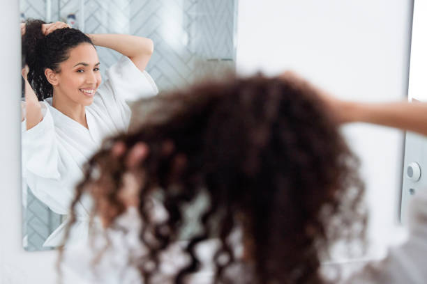 istock Bathroom Beauty: Woman in the Mirror 1726065910