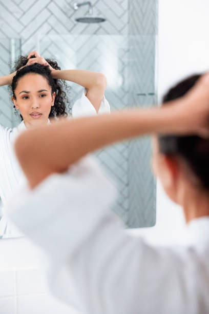 istock Bathroom Beauty: Woman in the Mirror 1726065912