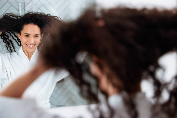 istock Bathroom Beauty: Woman in the Mirror 1726067639