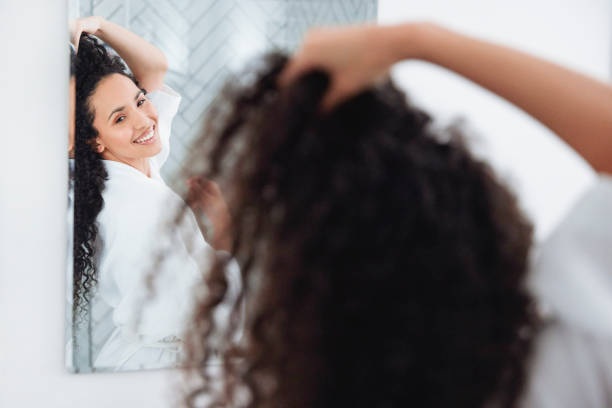 istock Bathroom Beauty: Woman in the Mirror 1726068153
