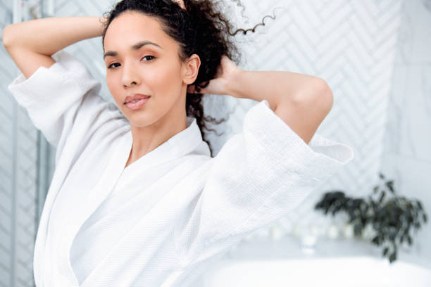 istock Bathroom Beauty: Woman in the Mirror 1726070861