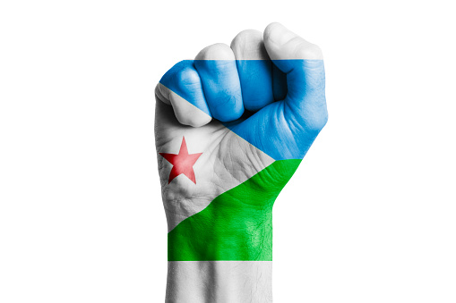 Man hand fist of DJIBOUTI flag painted. Close-up