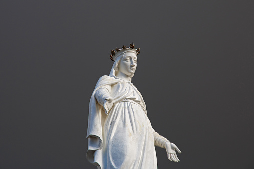 An image of the Holy Baby Jesus, a wooden sculpture carved in the XV century with olive wood from the Garden of Gethsemane in Jerusalem and covered with precious ex voto, present in a chapel of the ancient church of Santa Maria in Aracoeli, in the Capitoline Hill. According to popular belief, this figure is endowed with miraculous powers. Photo in high definition format.