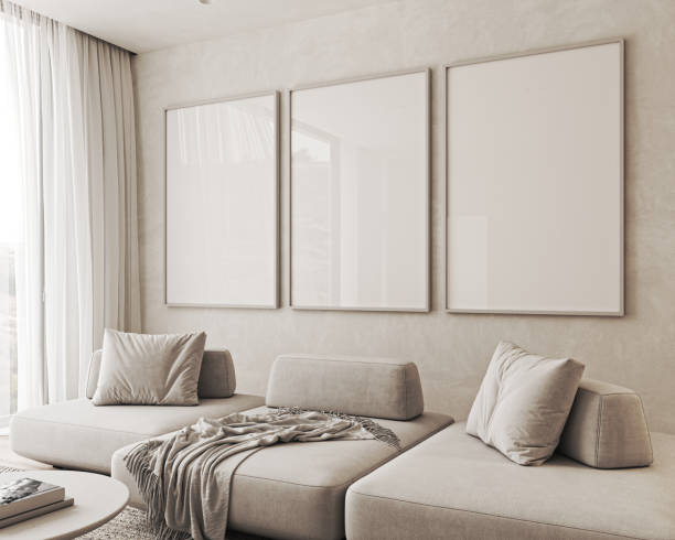 istock Contemporary classic white beige livingroom interior with three picture frame and decor. Empty stucco wall mockup. 3d rendering. High quality 3d illustration 1726081999