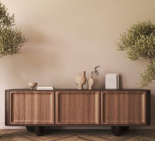 istock Japanese boho beige interior with ethnic commode and green tree plants background. Light modern australian livingroom. Mockup empty brown wall. 3d rendering. High quality 3d illustration 1726082577
