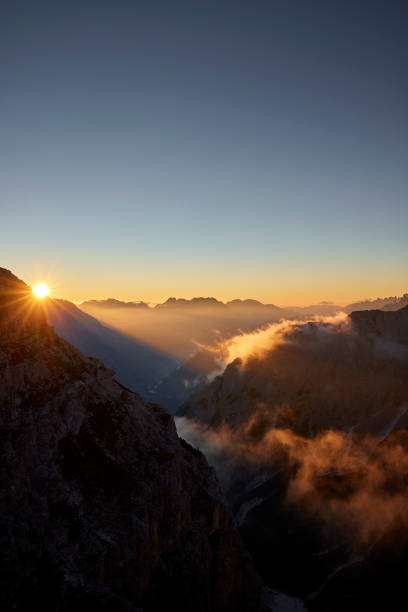 istock Mountain peaks during sunrise in the clouds 1726085398
