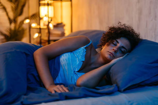 istock Young Woman Sleeping In The Bed At Night 1726088271