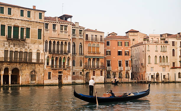 Romantic Gondola Ride Romantic gondola ride on the Venice Grand Canal. gondolier stock pictures, royalty-free photos & images