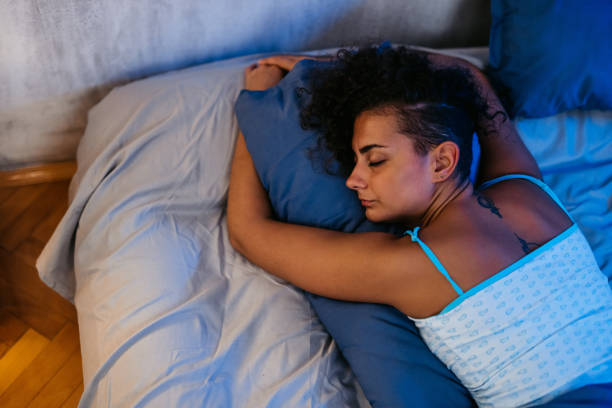 istock Young Woman Sleeping In The Bed At Night 1726093870