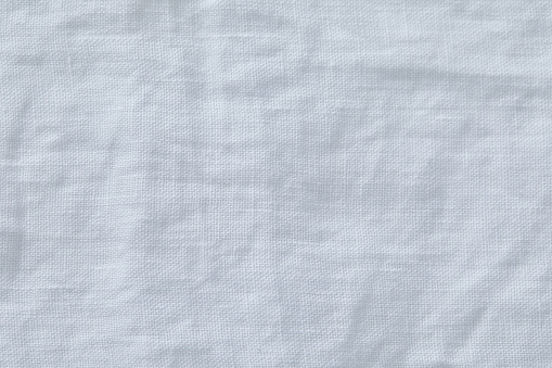 White linen table cloth texture background, empty with wrinkles, with copy space