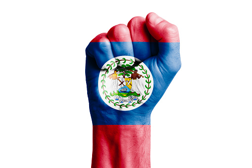 Man hand fist of BELIZE flag painted. Close-up