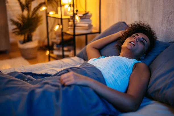 istock Young Woman Sleeping In The Bed At Night 1726096043