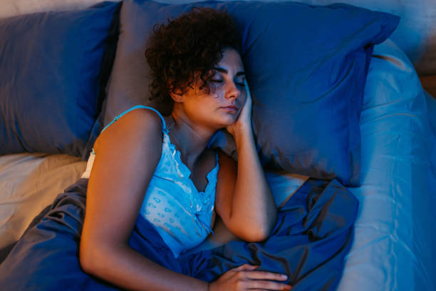 istock Young Woman Sleeping In The Bed At Night 1726103128