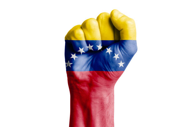 istock Man hand fist of VENEZUELA flag painted. Isolate 1726112677