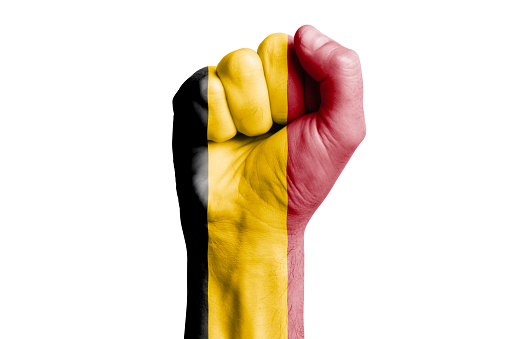 Man hand fist of BELGIUM flag painted. Close-up