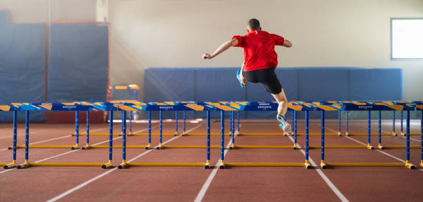 istock Male Runner Training And Jumping Over Hurdles 1726125258