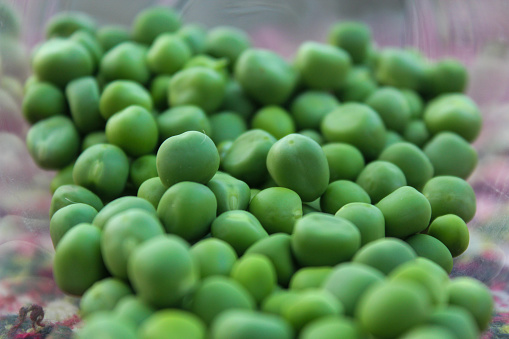 It's a pile of green peas sitting in the jar. They look so fresh and vibrant.