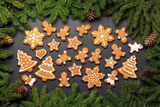 istock Christmas fir tree branch and various gingerbread cookies 1726168729