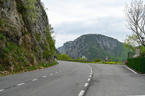 Asphalt road and green forest with mountain nature landscape in Djerdap Gorge. Serbia. High quality photo