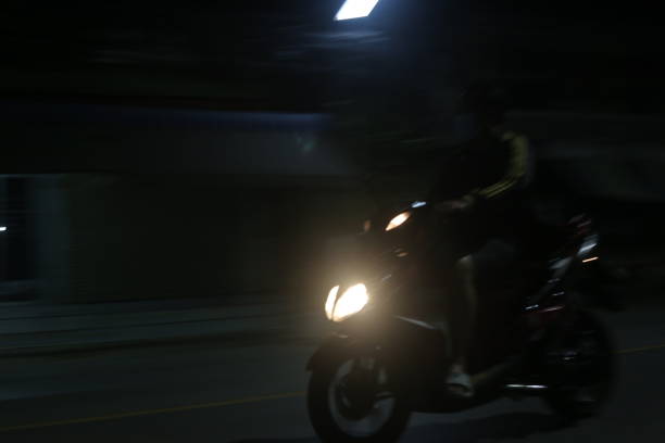 istock A man rides a motorcycle to go shopping. 1726172697